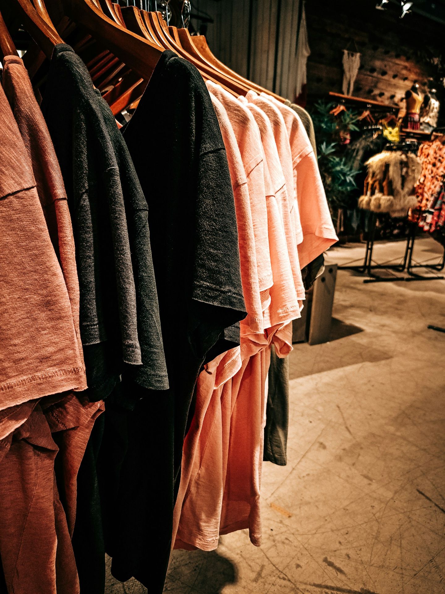 a row of clothes hanging on a rack